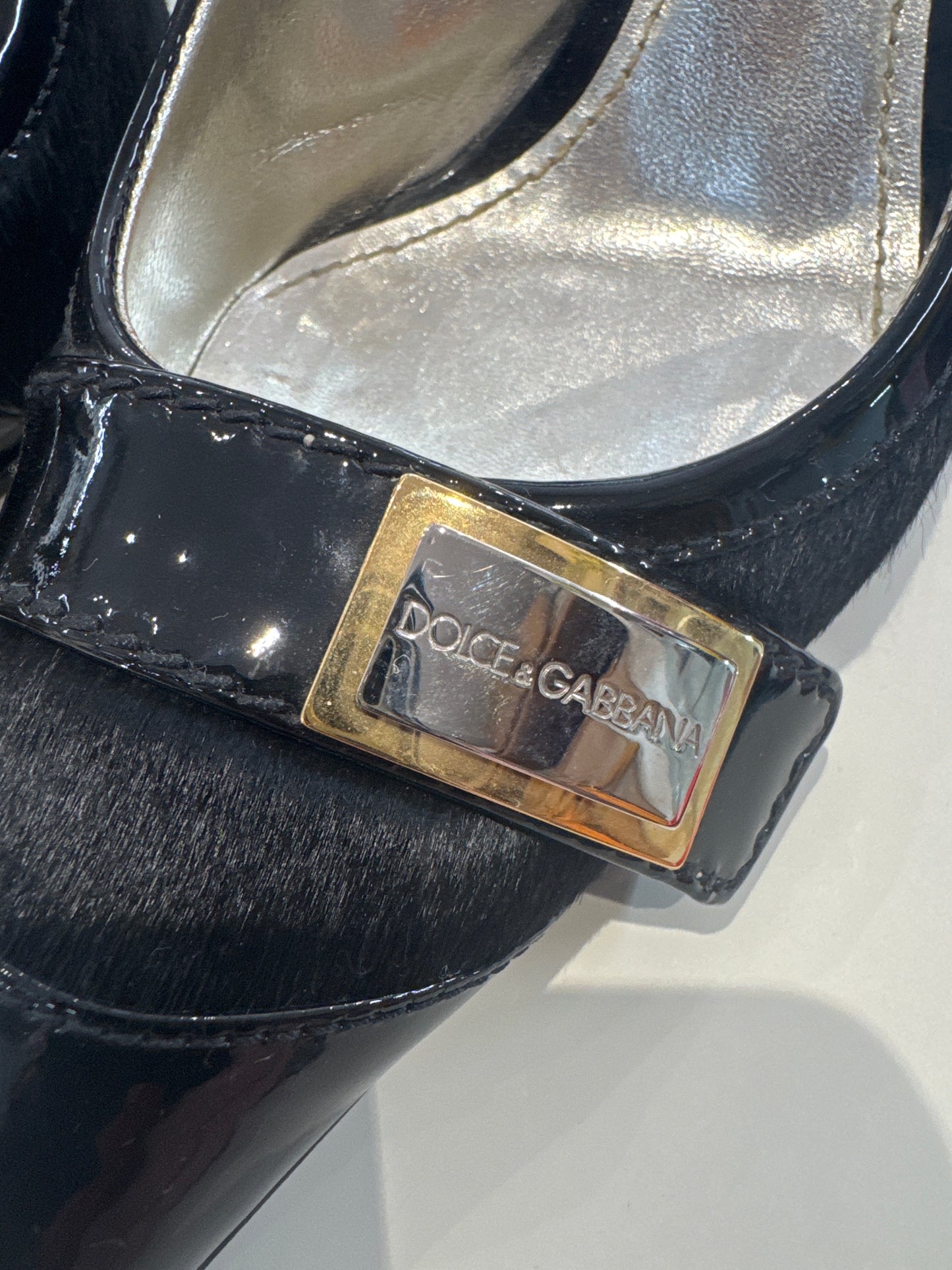 Dolce & Gabbana pony hair sling back heels.